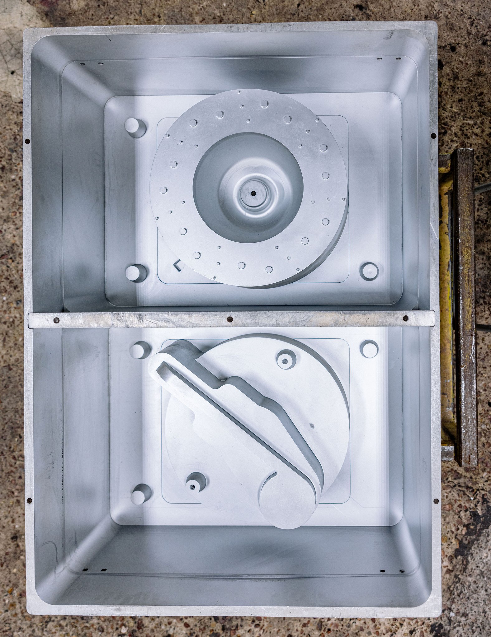 3D-printed sand mold (cope and drag) staged for pouring, no hard tooling required for a one-piece or short-run reverse-engineered casting.